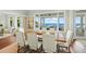 Elegant dining room with water views and a large wooden table at 641 Key Royale Dr, Holmes Beach, FL 34217