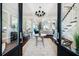 Bright and airy entryway with hardwood floors and access to living room at 641 Key Royale Dr, Holmes Beach, FL 34217