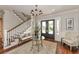 Spacious entryway with hardwood floors, staircase, and seating area at 641 Key Royale Dr, Holmes Beach, FL 34217
