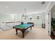 Game room with a pool table and plenty of space for entertainment at 641 Key Royale Dr, Holmes Beach, FL 34217