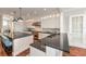 Gourmet kitchen with large island, stainless steel appliances, and white cabinetry at 641 Key Royale Dr, Holmes Beach, FL 34217