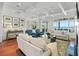 Spacious living room with hardwood floors, water views, and comfortable seating at 641 Key Royale Dr, Holmes Beach, FL 34217