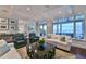 Spacious living room with hardwood floors, comfortable seating, and water views at 641 Key Royale Dr, Holmes Beach, FL 34217