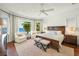 Main bedroom with water views and comfortable seating area at 641 Key Royale Dr, Holmes Beach, FL 34217