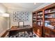 Home office with built-in bookshelves and a large desk at 641 Key Royale Dr, Holmes Beach, FL 34217