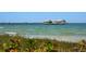 Scenic view of a pier extending into calm ocean water at 641 Key Royale Dr, Holmes Beach, FL 34217