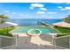 Inviting saltwater pool with spa and stunning waterfront views at 641 Key Royale Dr, Holmes Beach, FL 34217