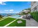 Stunning pool with a view of the water and private dock at 641 Key Royale Dr, Holmes Beach, FL 34217
