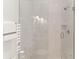 Clean and modern shower with white subway tile and a glass enclosure at 641 Key Royale Dr, Holmes Beach, FL 34217