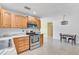 Kitchen with stainless steel appliances and wood cabinets at 6712 Georgia Ave, Bradenton, FL 34207