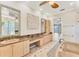 Elegant bathroom boasts double vanities, granite countertops, and a soaking tub at 6779 Ashley Ct, Sarasota, FL 34241