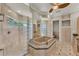 Spa-like bathroom with large walk-in shower, soaking tub, and glass blocks at 6779 Ashley Ct, Sarasota, FL 34241