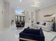Grand foyer showcasing a high ceiling, a decorative front door, and elegant furnishings at 6779 Ashley Ct, Sarasota, FL 34241