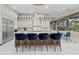 Spacious kitchen featuring an island with seating, modern lighting, and stainless steel appliances at 6779 Ashley Ct, Sarasota, FL 34241