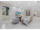 Bright living room with neutral tones and sleek tiled floors for a modern, clean aesthetic at 6779 Ashley Ct, Sarasota, FL 34241