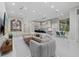 Spacious living room featuring a seating area, kitchen with a bar and a view of the outdoors at 6779 Ashley Ct, Sarasota, FL 34241