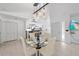 Dining area with glass table and chairs, near kitchen and entryway at 721 Houle Avenue Ave, Sarasota, FL 34232