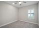 Spacious bedroom with grey carpet and window shutters at 8303 Dove Bog Ter, Parrish, FL 34219