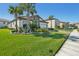 One-story house with lush landscaping and palm trees at 8303 Dove Bog Ter, Parrish, FL 34219