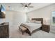 Spacious main bedroom with a king-size bed, nightstands and TV at 8303 Dove Bog Ter, Parrish, FL 34219