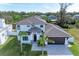 Modern two-story house with a gray roof, paver driveway, and lush lawn at 901 30Th E Ct, Bradenton, FL 34208