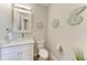 Stylish powder room with glass sink and seashell decor at 901 30Th E Ct, Bradenton, FL 34208