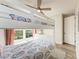 Bedroom with a white bunk bed, window, and light flooring at 901 30Th E Ct, Bradenton, FL 34208