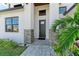 Front entrance with stone accents and a dark brown door at 901 30Th E Ct, Bradenton, FL 34208