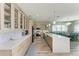 Modern kitchen with white quartz countertops and light wood cabinets at 901 30Th E Ct, Bradenton, FL 34208