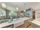 Modern kitchen with farmhouse sink and white quartz countertops at 901 30Th E Ct, Bradenton, FL 34208