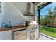 Outdoor kitchen with stainless steel appliances and a wood countertop at 901 30Th E Ct, Bradenton, FL 34208