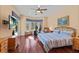 Spacious main bedroom with hardwood floors and access to the pool at 9604 53Rd E Ter, Bradenton, FL 34211