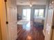 Main bedroom with hardwood floors, private balcony, and water views at 9923 Manatee W Ave # 4, Bradenton, FL 34209