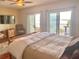 Main bedroom with water views and king-size bed at 9923 Manatee W Ave # 4, Bradenton, FL 34209