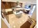 Open concept kitchen with center island, custom cabinetry and breakfast bar at 9923 Manatee W Ave # 4, Bradenton, FL 34209