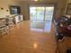 Spacious living area with hardwood floors, large windows, and direct water views at 9923 Manatee W Ave # 4, Bradenton, FL 34209
