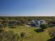 Aerial view of clubhouse and putting green at 9937 Laurel Valley Avenue Cir, Lakewood Ranch, FL 34202