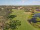 Aerial view of golf course and houses nearby at 9937 Laurel Valley Avenue Cir, Lakewood Ranch, FL 34202