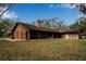 Ranch-style home with a screened porch overlooking the backyard at 10616 Forest Run Dr, Bradenton, FL 34211