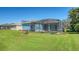 Backyard view showing the pool and screened enclosure at 10643 Old Grove Cir, Bradenton, FL 34212