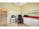 Bright home office with desk and built-in shelves at 10643 Old Grove Cir, Bradenton, FL 34212