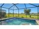 Refreshing screened pool with golf course views at 10643 Old Grove Cir, Bradenton, FL 34212