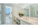 Modern bathroom with double sinks and white cabinetry at 1155 N Gulfstream Ave # 207, Sarasota, FL 34236