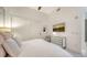 Bright bedroom with mounted TV and modern decor at 1155 N Gulfstream Ave # 207, Sarasota, FL 34236