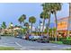 Evening street scene with palm trees and shops at 1155 N Gulfstream Ave # 207, Sarasota, FL 34236