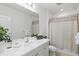 Clean bathroom with white vanity, shower/tub combo and updated fixtures at 12939 Seasong Ter, Bradenton, FL 34211