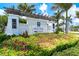 Indigo community entrance with a beautiful pergola and landscaping at 12939 Seasong Ter, Bradenton, FL 34211