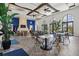 Bright community room with tables, chairs, and a fireplace at 12939 Seasong Ter, Bradenton, FL 34211