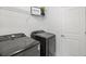 Laundry room with washer, dryer, and overhead shelving at 12939 Seasong Ter, Bradenton, FL 34211