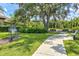 Playground nestled under large trees, with musical instrument at 12939 Seasong Ter, Bradenton, FL 34211